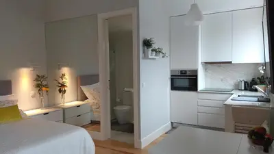a white kitchen with a bed in a room at S Bento Boutique Apartment in Porto