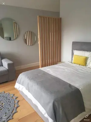 a bedroom with a large bed and a mirror at S Bento Boutique Apartment in Porto