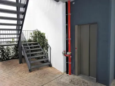 a staircase next to a building with a fire hydrant at Oporto Delight 2 Luxury Apartment in Historic Center Max 4p in Porto