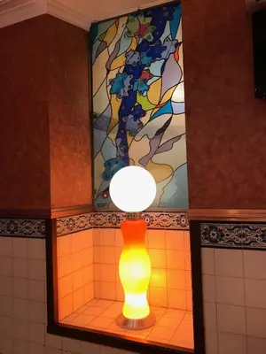 a yellow light in a bathroom with a stained glass window at Hotel Internacional Porto in Porto