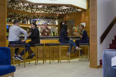 a group of people sitting at a bar at Casual Inca Porto in Porto