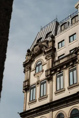 a tall building with windows on top of it at Hotel da Bolsa in Porto