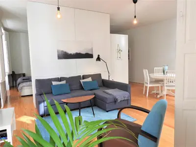a living room with a couch and a table at Oporto Delight 1 Luxury Apartment in Historic Center with Balcony Max 4 p in Porto
