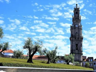 a tall tower with a clock on top of it at Oporto Delight 1 Luxury Apartment in Historic Center with Balcony Max 4 p in Porto