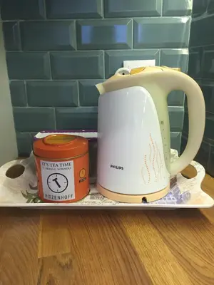 a tea kettle and a container on a tray at SantOporto Baixa in Porto