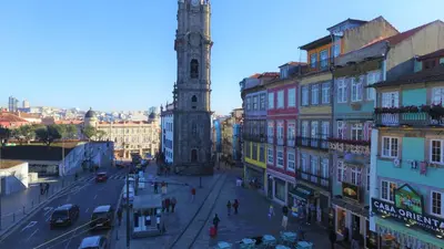 a city street with a clock tower and buildings at Janika's Patio in Porto