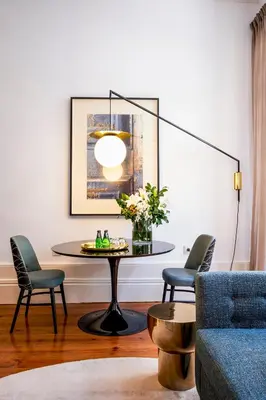 a living room with a table and two chairs at The A5 Smart Luxury Studios in Porto