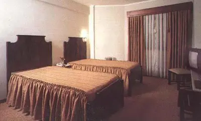 a hotel room with two beds in a room at Hotel Palanca in Porto