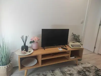 a television on a wooden desk with a keyboard at Oporto Lovely House in Porto