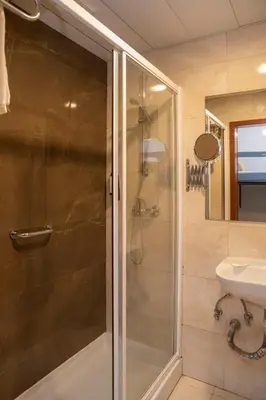 a bathroom with a shower and a sink at WOT Porto Soul in Porto