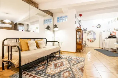 a bedroom with a bed and a rug at Red House 2- With terrace in Porto
