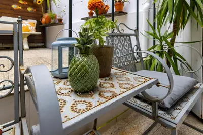 a table with a pineapple vase on top of it at Red House 2- With terrace in Porto