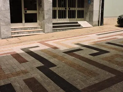 a checkered floor in front of a building at Art Gallery Apartment in Porto