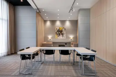 a conference room with a table and chairs at AC Hotel Porto by Marriott in Porto