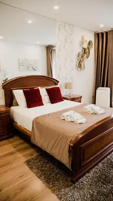 a bedroom with a large bed with red pillows at Bruval Premium Apartments - Sé Porto in Porto