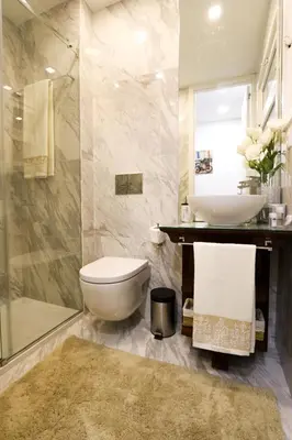 a bathroom with a toilet and a sink and a shower at Bruval Premium Apartments - Sé Porto in Porto