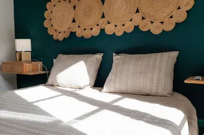 a bedroom with a bed with a blue wall at Ren Feb26 Clerigos Retreat in Porto