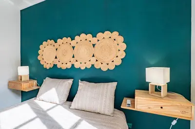 a bedroom with a bed and a blue wall at Ren Feb26 Clerigos Retreat in Porto