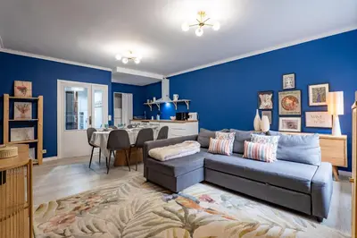 a living room with a couch and a dining room at Ren Feb26 Clerigos Retreat in Porto