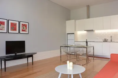 a living room with a couch and a tv at Casa Paillard, by Flat in Porto in Porto