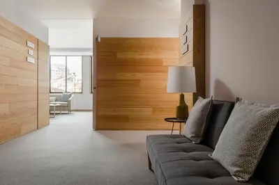 a living room with a couch and a lamp at ClipHotel in Vila Nova de Gaia
