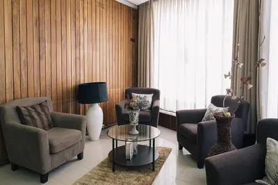 a living room with two chairs and a table at Hotel Sao Jose in Porto