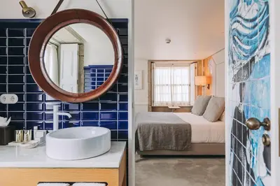 a bathroom with a sink and a mirror at Gran Cruz House in Porto