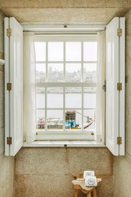 an open window with a view of the water at Gran Cruz House in Porto