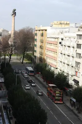 a view of a city street with cars and buildings at Hotel Vice-Rei in Porto