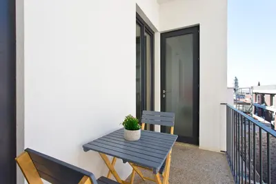 a blue table and two chairs on a balcony at OTF- Porto Centro in Porto