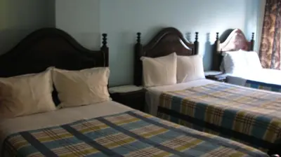 a bedroom with two beds with pillows at Residencial Porto Novo - Alojamento Local in Porto
