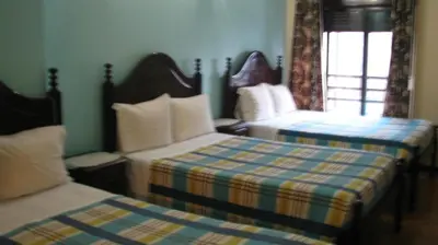 a bedroom with two beds and a window at Residencial Porto Novo - Alojamento Local in Porto