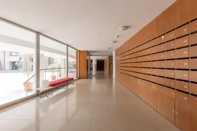 a hallway with a red bench in a building at Aposentus - Arrábida Studio in Vila Nova de Gaia