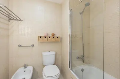 a bathroom with a toilet and a shower and a sink at Aposentus - Arrábida Studio in Vila Nova de Gaia