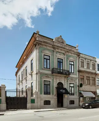 an old building on the corner of a street at The Rex Hotel Porto - Mansion House - Private Parking in Porto