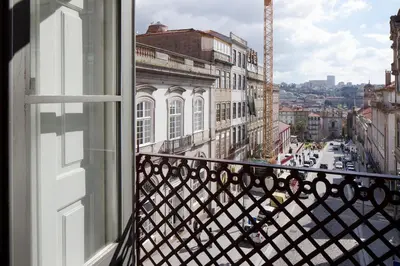 a view of a city street from a window at Cale Guest House in Porto