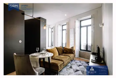 a living room with a couch and a table at ORM - Camões Apartment in Porto