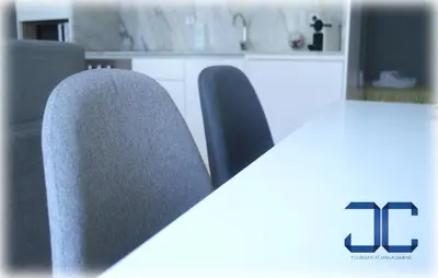 two chairs sitting in a kitchen with a table at #Four Apartment by JC in Porto