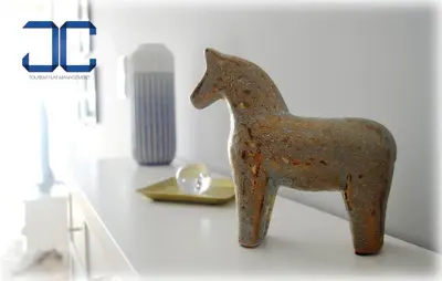 a metal figurine of a horse on a table at #Four Apartment by JC in Porto