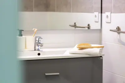 a bathroom with a sink and a shower at LovelyStay - Boavista Cozy Apartment in Porto