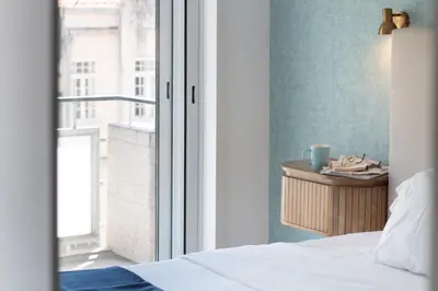 a bedroom with a bed next to a window at LovelyStay - Boavista Cozy Apartment in Porto