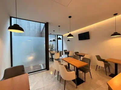 a bathroom with a toilet and a sink and a shower at Mystay Porto Batalha in Porto