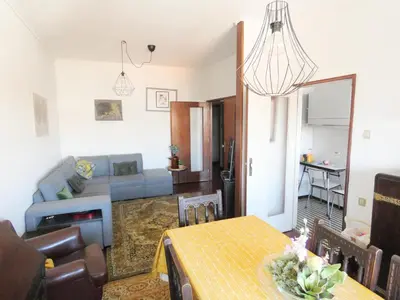 a living room with a table and a couch at Grandmotherhouse 2-7 Pax in Porto