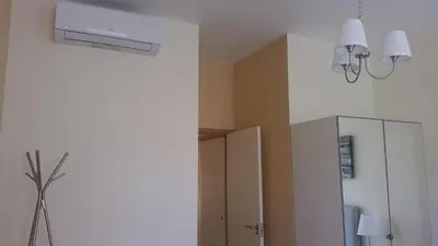 a bathroom with a ceiling fan and a cabinet at Downtown Porto with PARKING next to subway in Porto