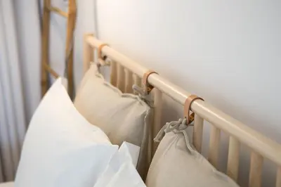 a close up of a crib with pillows on it at LovelyStay - Martires Boutique Flat in Porto