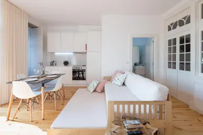 a living room with a couch and a table at LovelyStay - Martires Boutique Flat in Porto