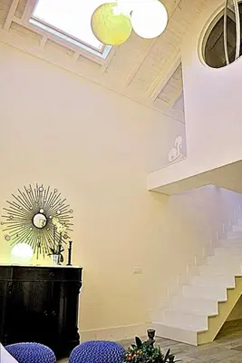 a living room with a staircase and a window at Casa Braancamp - Beautiful & Calm in Porto