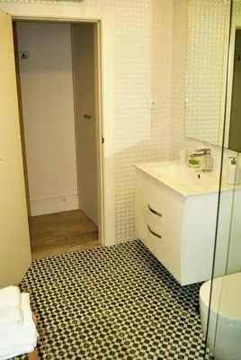 a bathroom with a sink and a mirror at Casa Braancamp - Beautiful & Calm in Porto