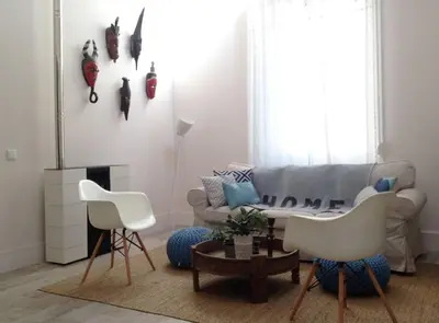 a living room with a couch and two chairs at Casa Braancamp - Beautiful & Calm in Porto
