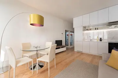 a dining room and kitchen with a table and chairs at BmyGuest - Villa Lóios Terrace Apartment in Porto
